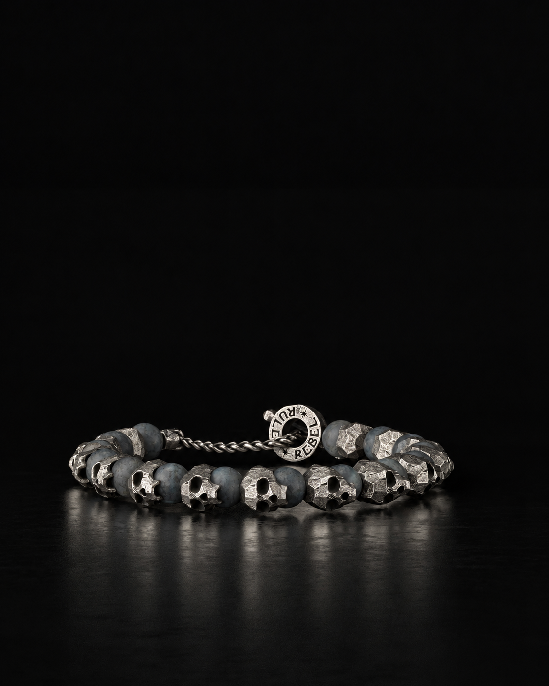 Raw I Bracelet, Labradorite Matte beads between cast silver skulls, on black