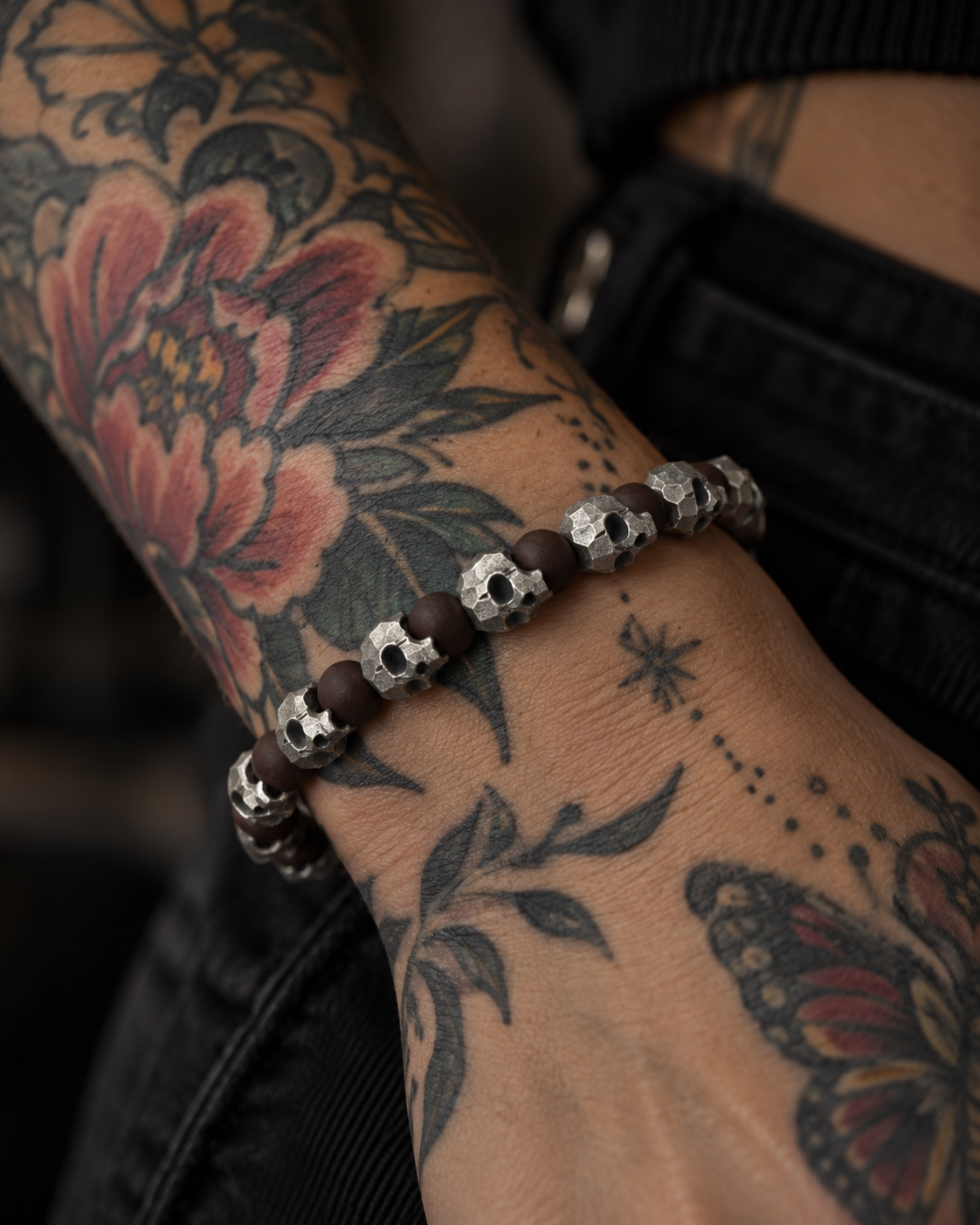 Raw I Bracelet in Red Brecciated Matte, worn on a wrist tattooed with a peony