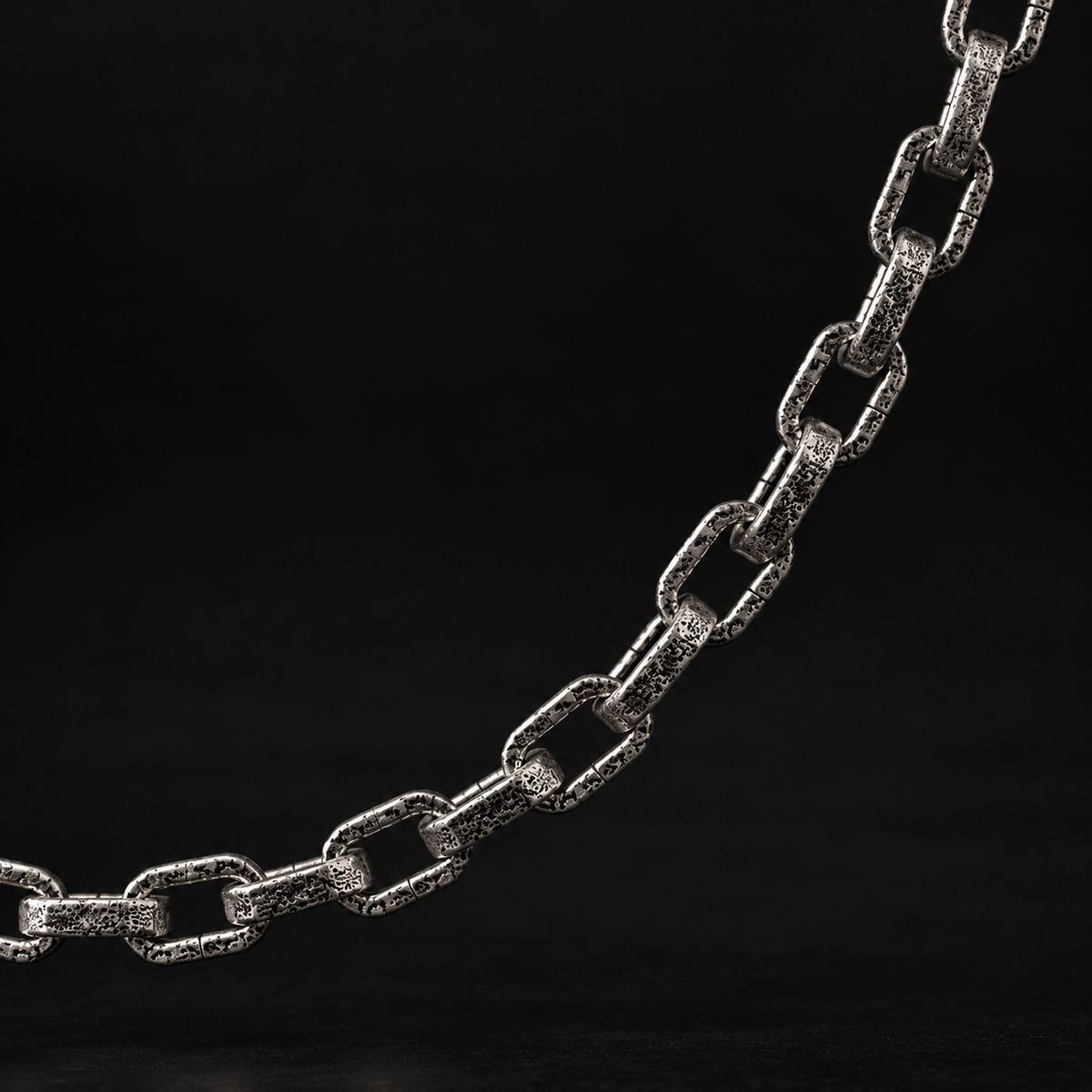 Raw I Necklace close up, rough cast surface on each chunky oval link