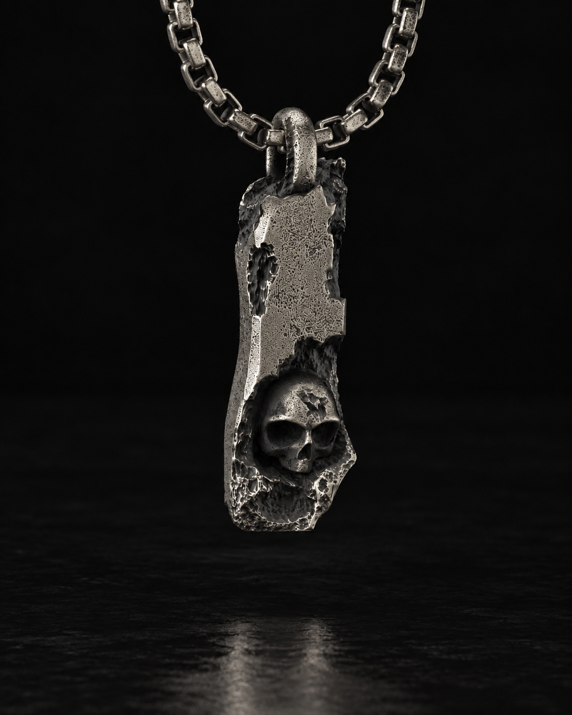 Raw I Pendant close up, skull set into the cratered bar with a star cut into its forehead
