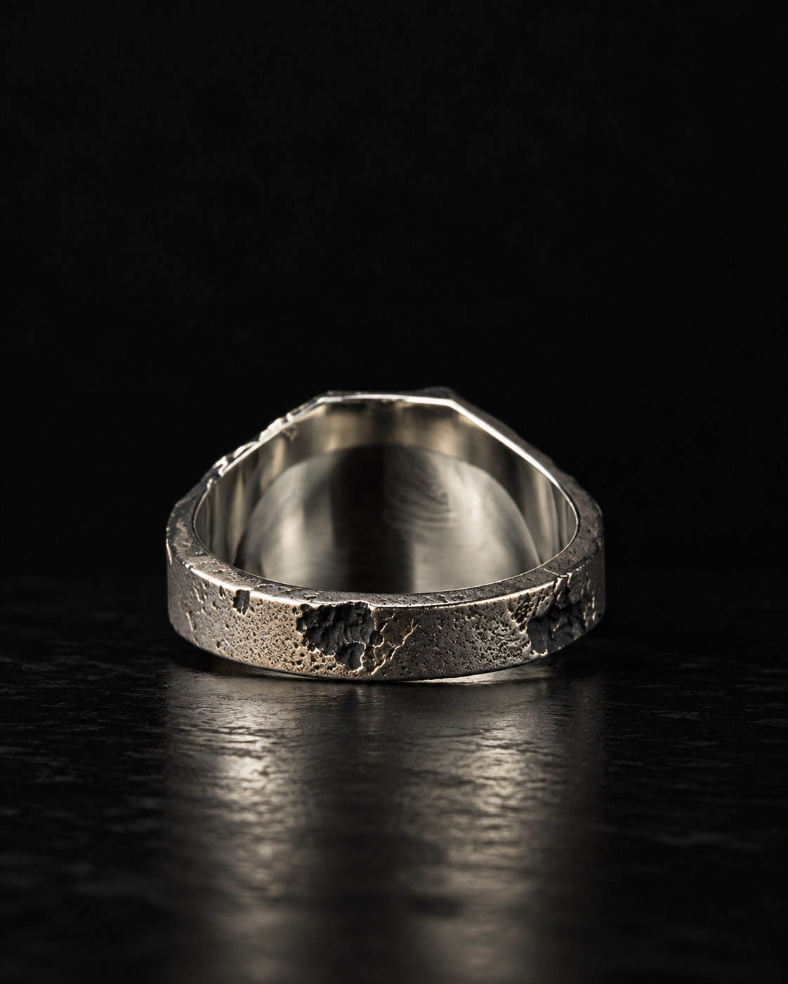 Raw I Ring from behind, mirror polished inside the band against the pitted outside