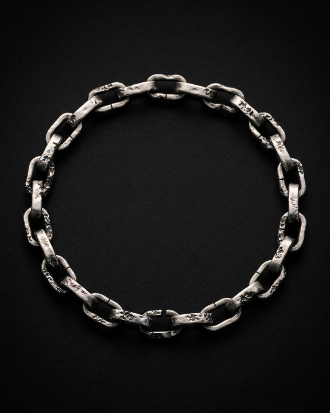 Raw II Bracelet from above, the pitted silver links laid in an oval