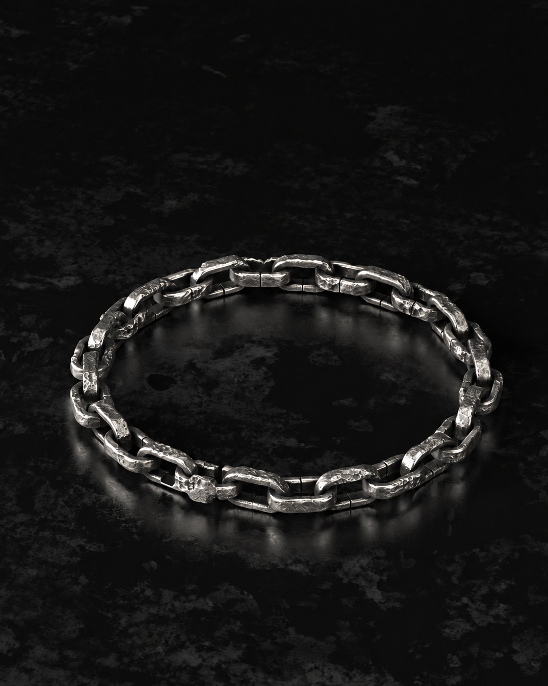 Raw II Bracelet resting in an open oval on dark mottled stone