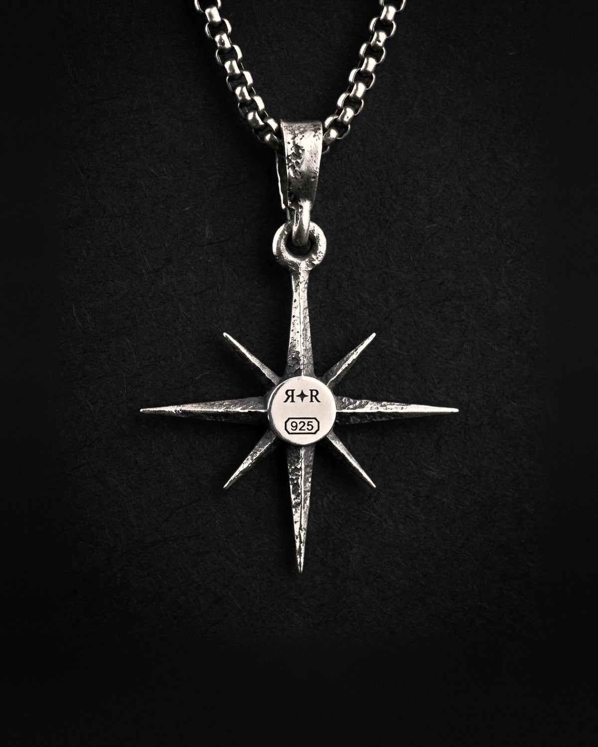 Raw IV Pendant from behind, the RR star hallmark and 925 laser engraved on a smooth disc at the centre of the faceted back