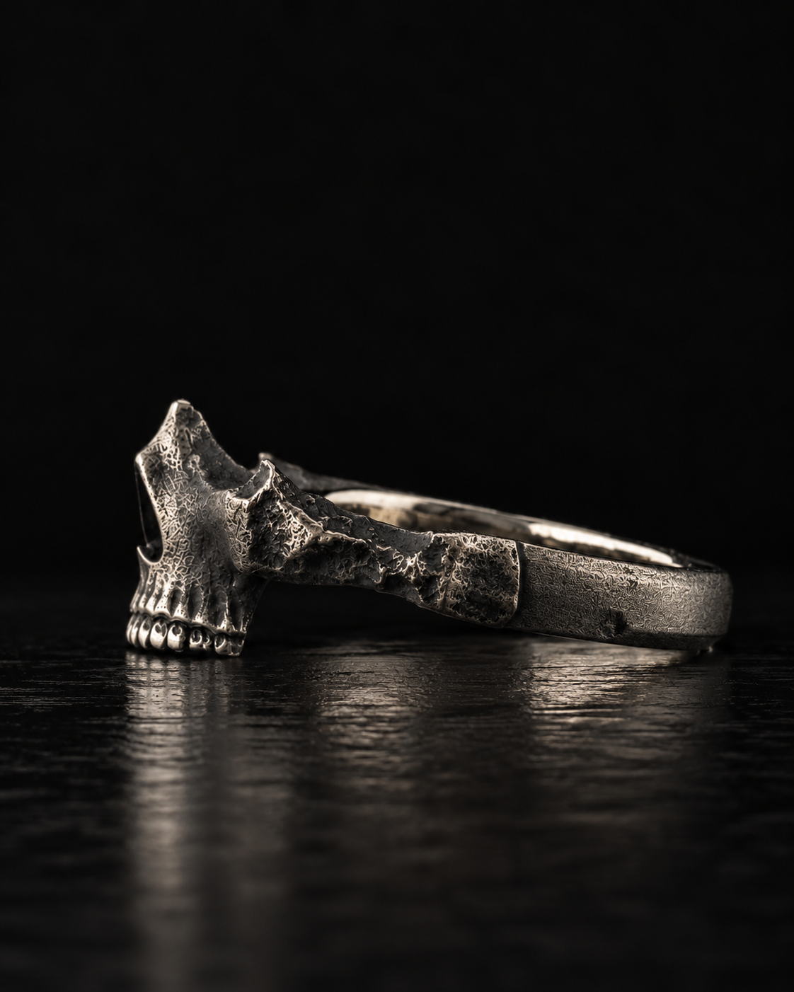 Raw IV Ring from the side, the skull jaw and teeth where the band begins