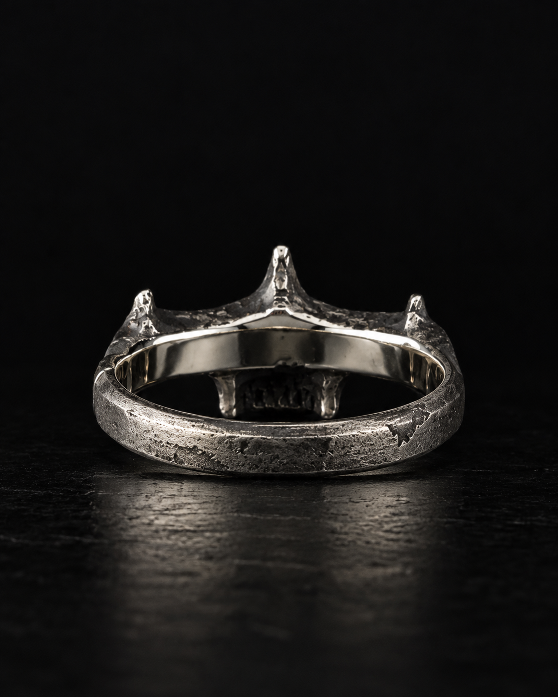 Raw IV Ring from behind, smooth polished inner band under the back of the skull
