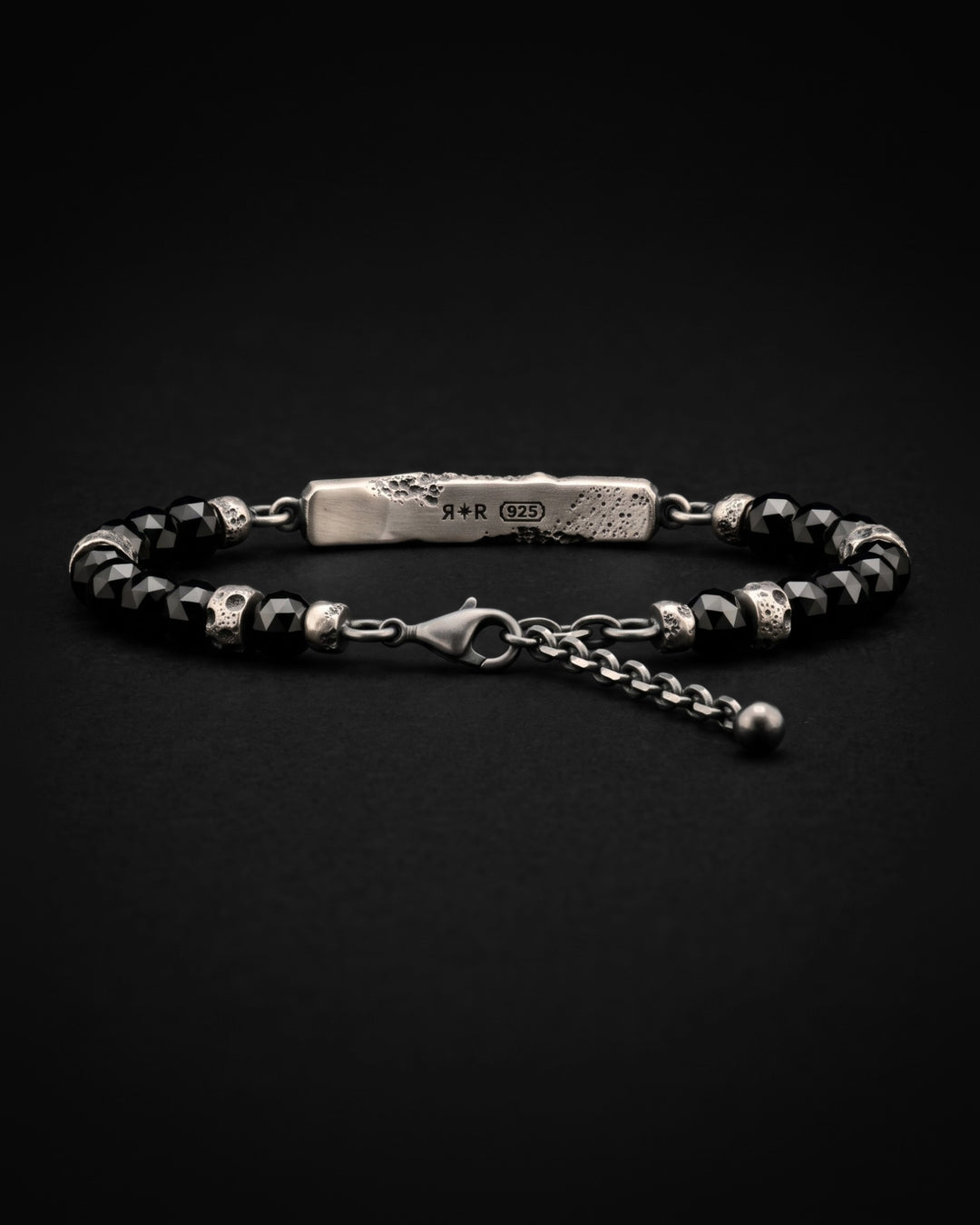 Raw V Bracelet from behind, the RR star and 925 hallmarks laser engraved on the inner face of the bar, with black spinel beads