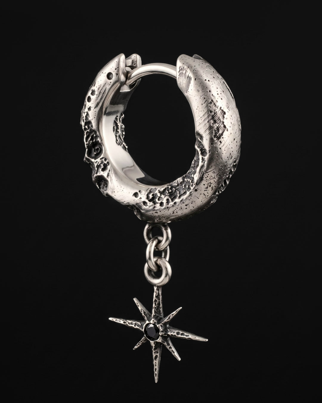 Raw VI Earring from the other side, the mirror-polished inside of the hoop and the star hanging below