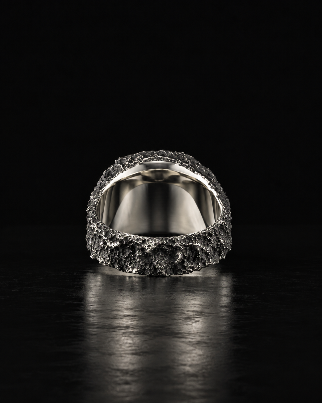 Raw VII Ring from behind, mirror-smooth inner band under the rough outer shank