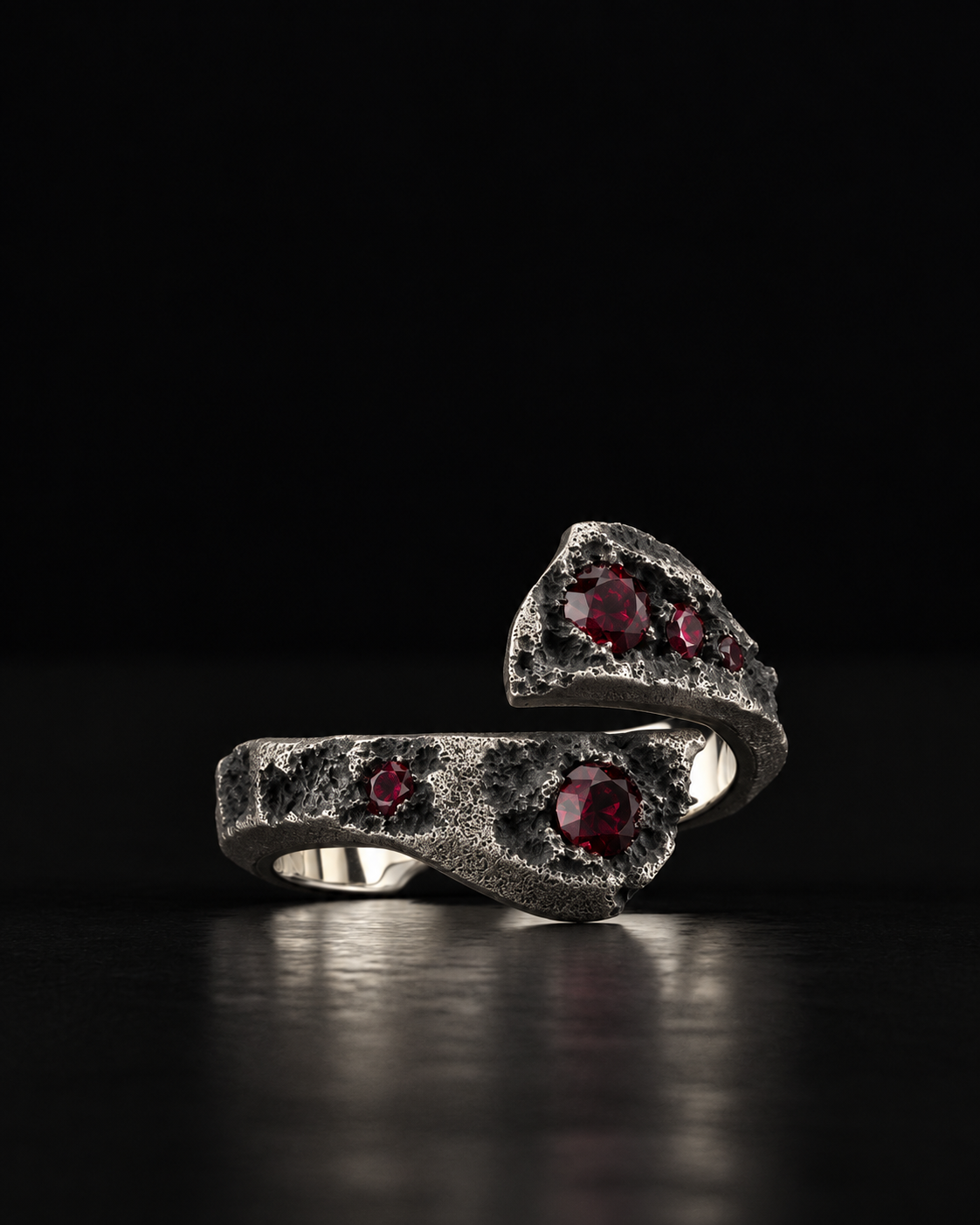 Raw XVII Ring with Ruby stones, the two ends of the open band seen from the side