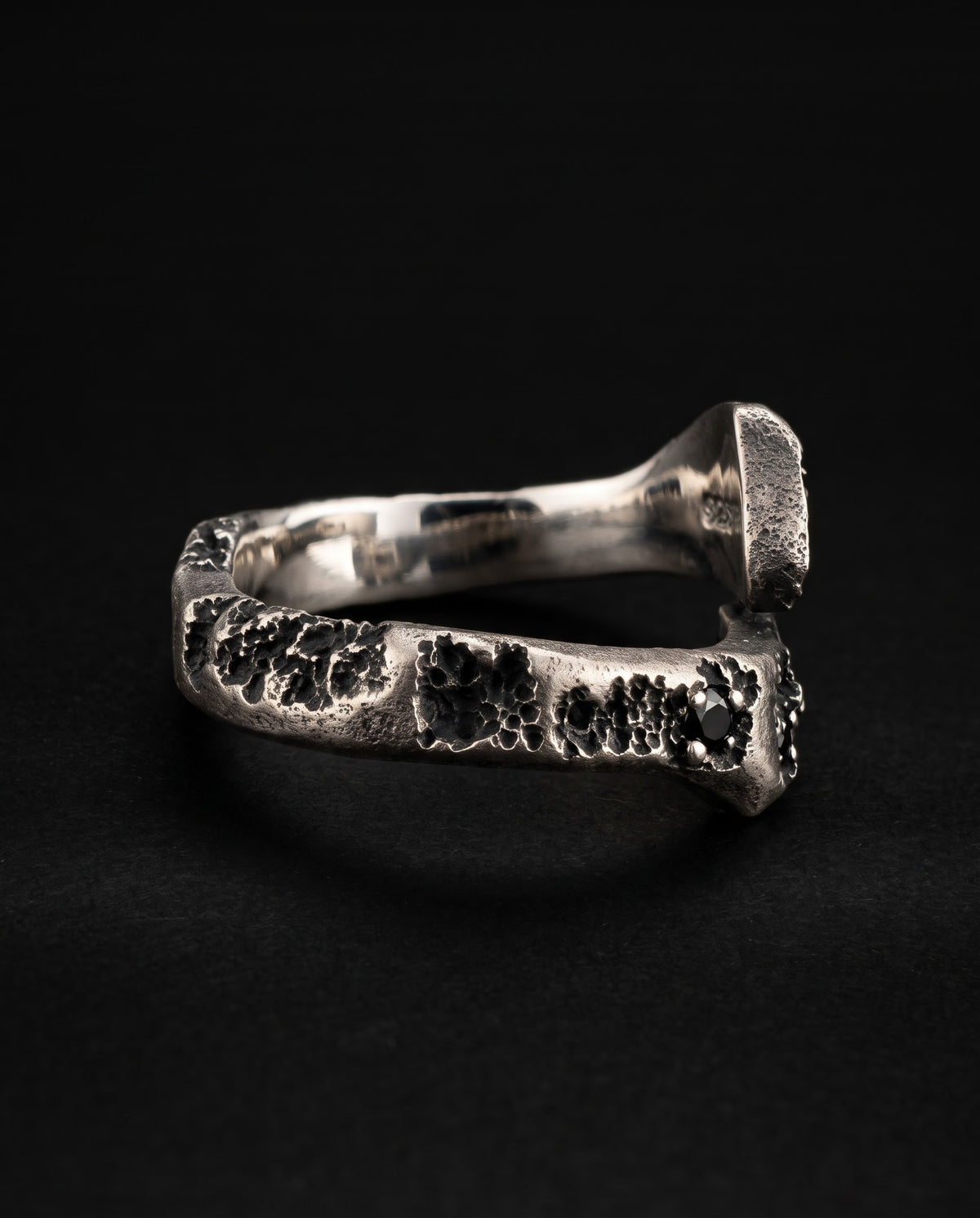 Raw XVII Ring in profile, the cratered band and the 925 hallmark inside the mirror-polished band